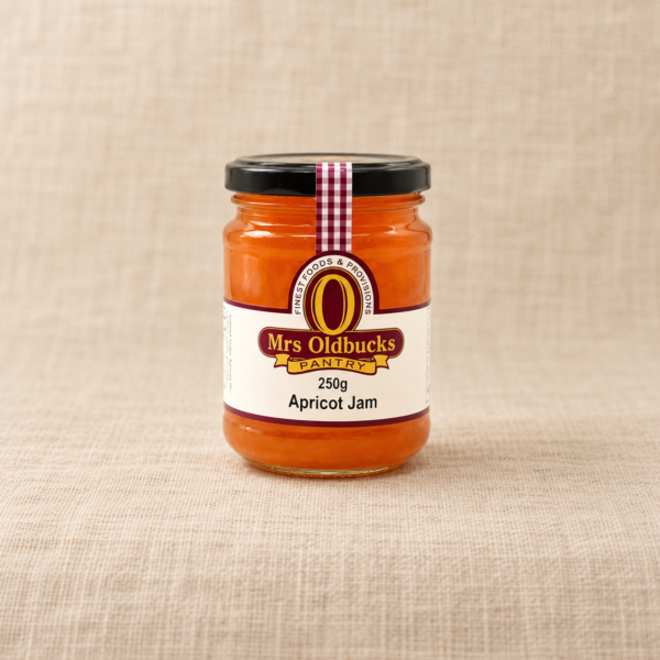 Mrs Oldbucks Pantry 250g Apricot Jam jar on a warm beige linen background