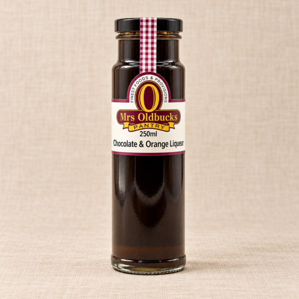 Mrs Oldbucks Pantry Chocolate & Orange Liqueur 250 ml glass bottle with a black lid on a warm beige linen background.