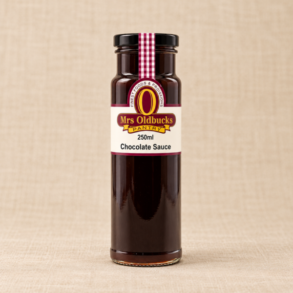 Mrs Oldbucks Pantry Chocolate Sauce 250 ml glass bottle with a black lid on a warm beige linen background.