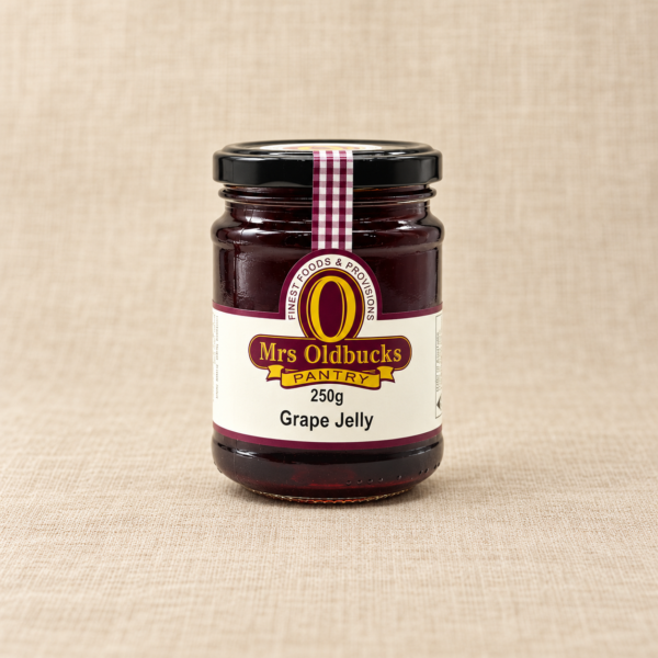 Mrs Oldbucks Pantry Grape Jelly 250g jar on a warm beige linen background