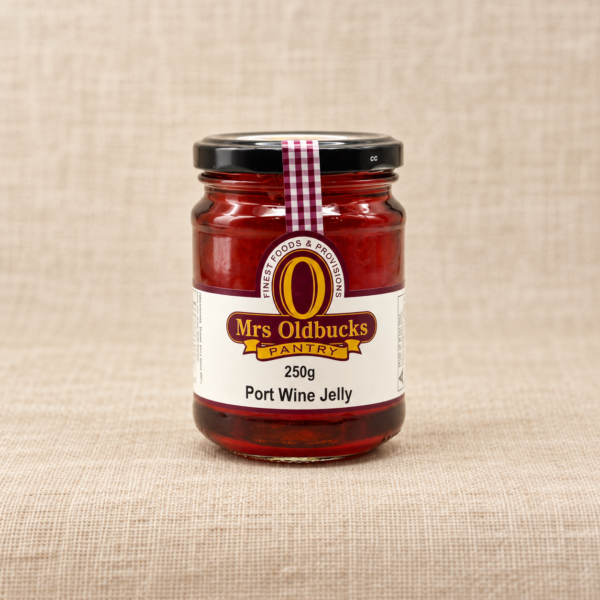 Mrs Oldbucks Pantry Port Wine Jelly 250g jar on a warm beige linen background