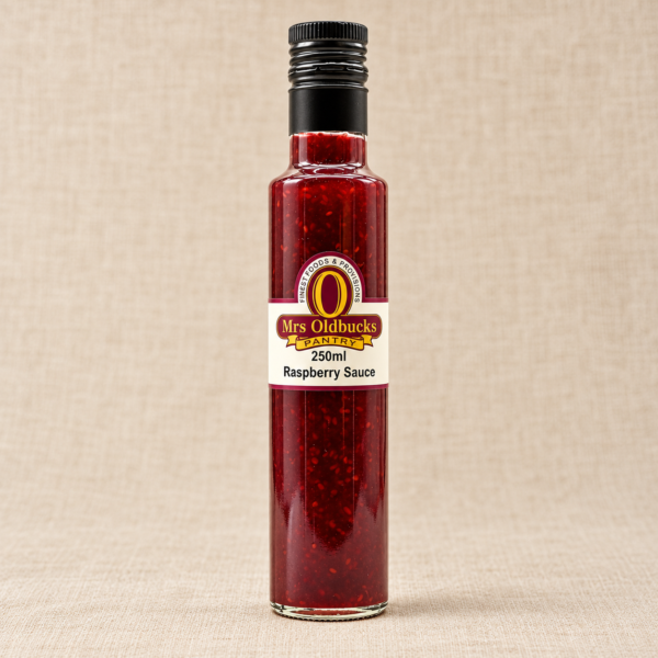 Mrs Oldbucks Pantry Raspberry Sauce 250 ml glass bottle with a black screw cap on a warm beige linen background.