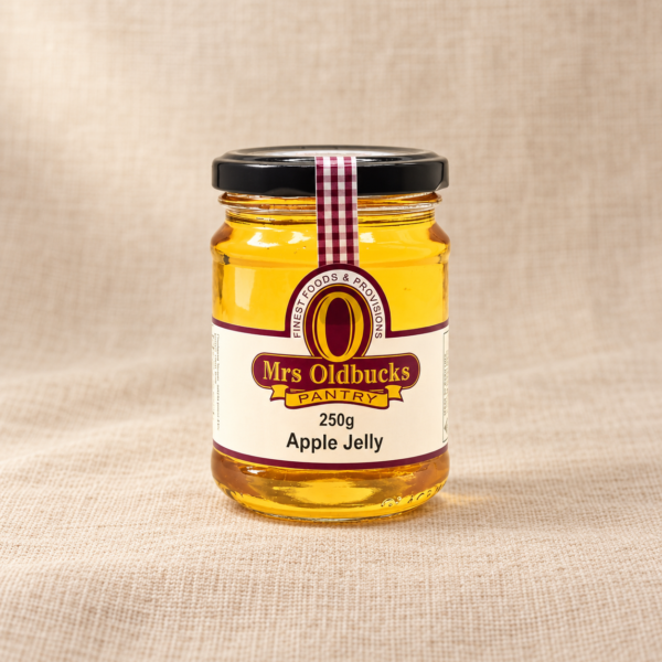 Mrs Oldbucks Pantry Apple Jelly 250g jar on a warm beige linen background