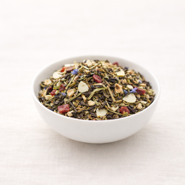 Mrs Oldbucks Pantry Highlands Mist white tea with fruit pieces and cornflower petals in a white ceramic bowl on neutral linen in soft natural light.