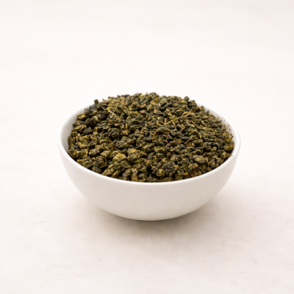Mrs Oldbucks Pantry Oolong Mountain TopLoose leaf Mountain Top Formosa Oolong tea displayed in a white ceramic bowl on a soft neutral background with light green brewed infusion.