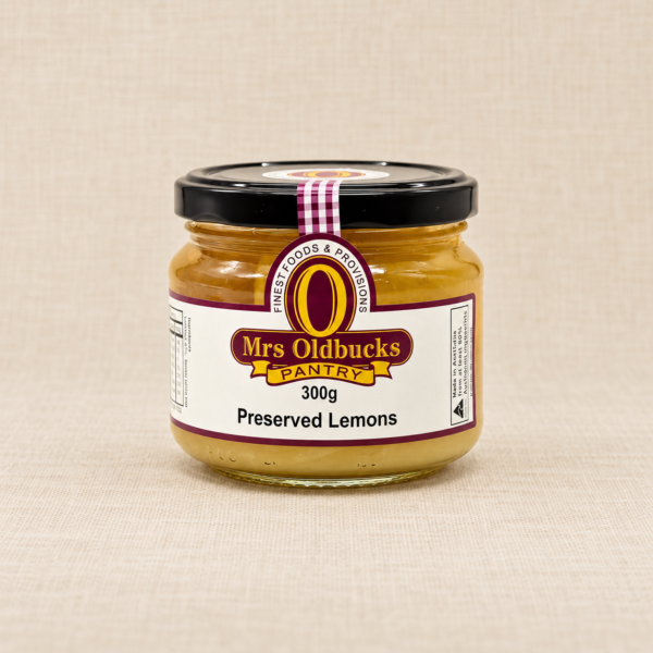 Mrs Oldbucks Pantry Preserved Lemons 300g jar on a warm beige linen background.