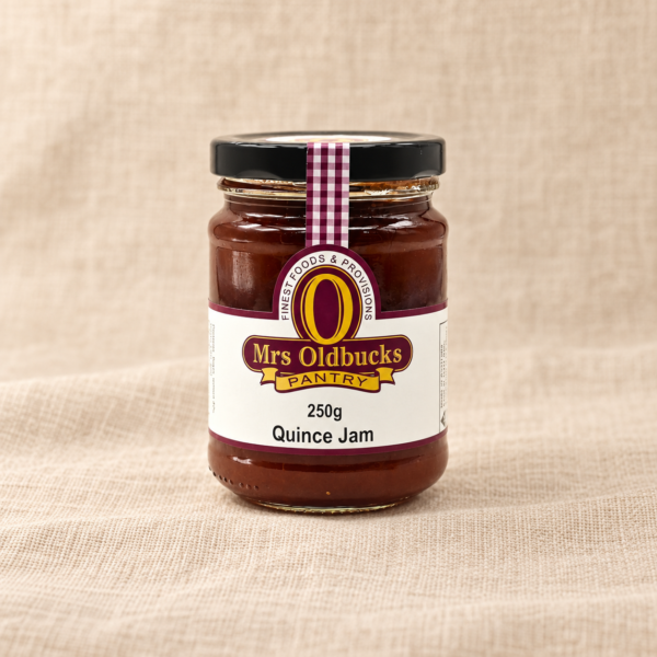Mrs Oldbucks Pantry Quince Jam 250g jar on a warm beige linen background