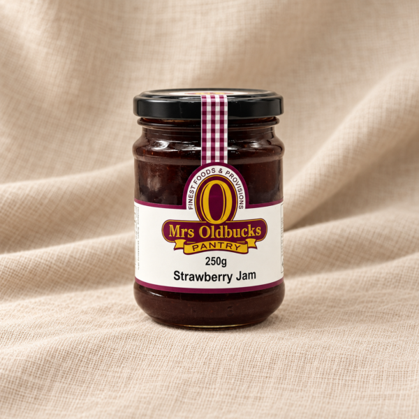 Mrs Oldbucks Pantry Strawberry Jam 250g jar on a warm beige linen background