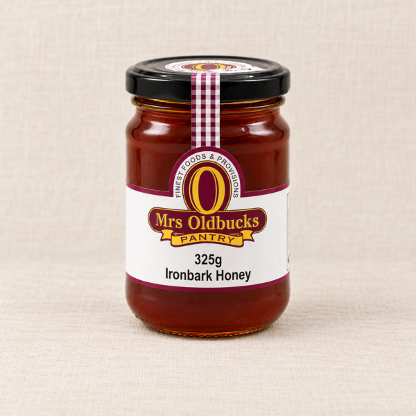 Mrs Oldbucks Pantry Ironbark Honey 325g jar on a warm linen background