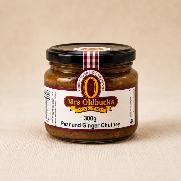 Mrs Oldbucks Pantry Pear & Ginger Chutney 300g in a glass jar on a soft linen background. Sweet pear and warming ginger chutney for cheese boards, roast pork, ham and gourmet entertaining.