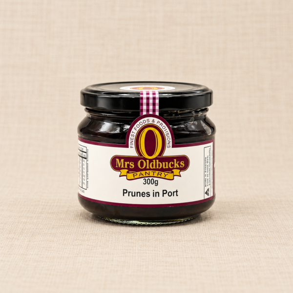 Mrs Oldbucks Pantry Prunes in Port 300g jar on a warm beige linen background.