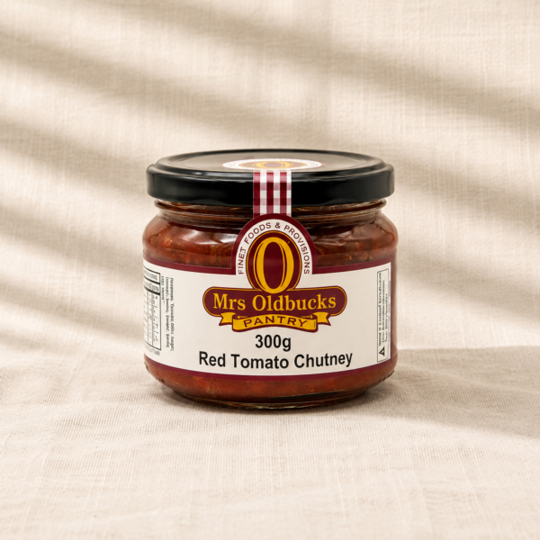 Mrs Oldbucks Pantry Red Tomato Chutney 300g in a glass jar on a natural linen background, a traditional Australian tomato chutney perfect for cheese boards, sandwiches and gourmet entertaining.