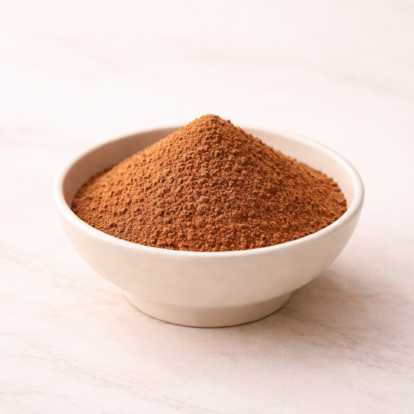 Mrs Oldbucks Pantry Sicilian Orange Chocolate Powder Ivory ceramic bowl of Sicilian orange hot chocolate powder (35% cocoa) on a warm neutral background, styled in soft luminous studio light.