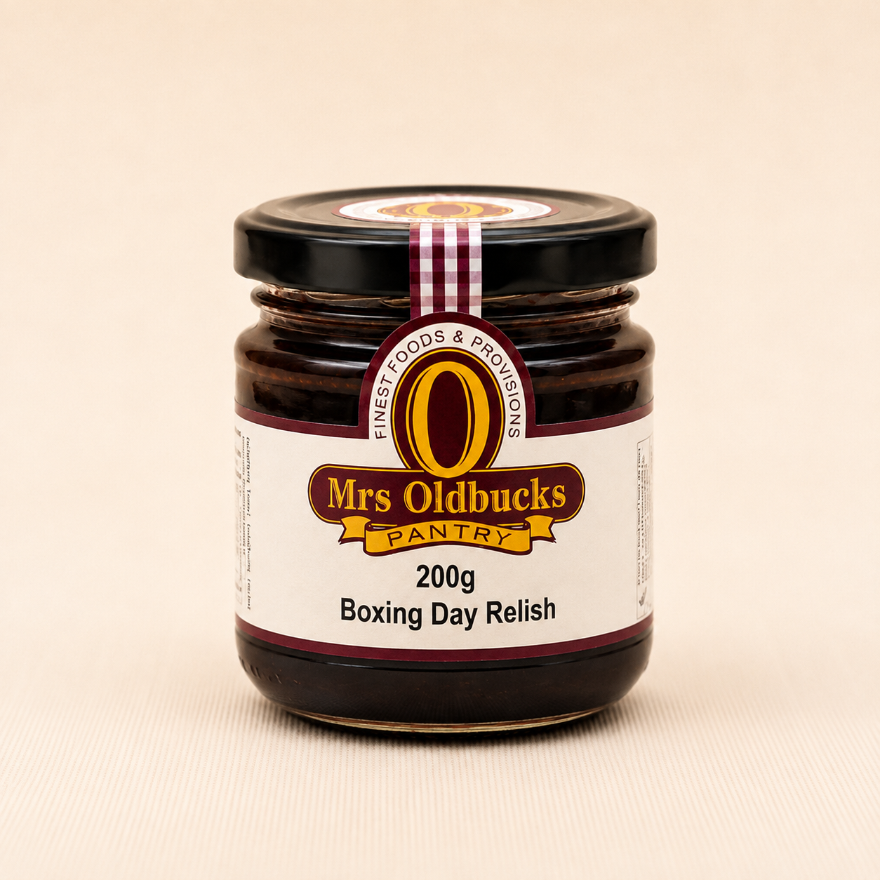 Mrs Oldbucks Pantry Boxing Day Relish 200g in a glass jar on a natural linen background, a festive pineapple and cranberry relish perfect for Christmas ham, turkey, cheese boards and Boxing Day entertaining.