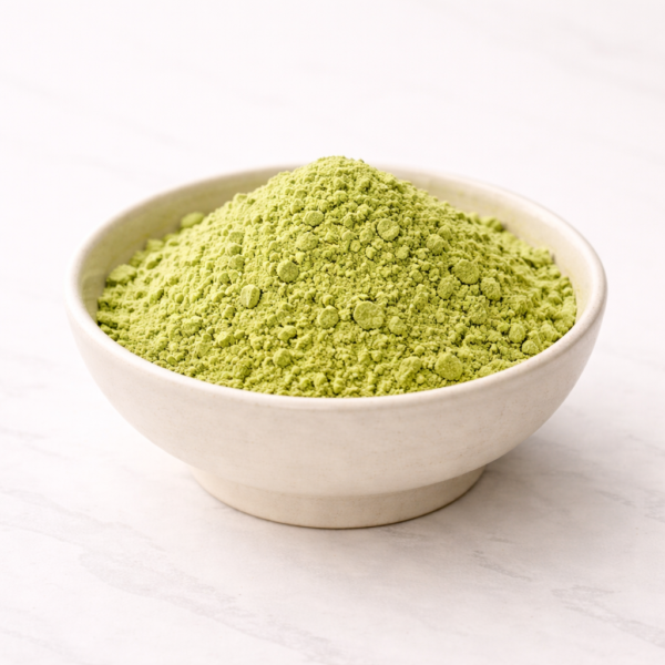 Mrs Oldbucks Pantry Matcha Green Tea PowderBright green Japanese Matcha powder with natural clumping and soft, velvety texture, presented in a neutral ceramic bowl.