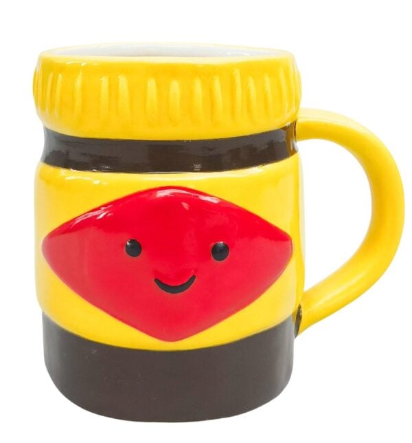 Mrs Oldbucks Pantry Oz Icon Mug Black And Yellow Yellow ceramic mug inspired by an iconic Australian spread jar, with black band detail and smiling red front design on a white background.