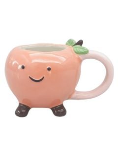 Mrs Oldbucks Pantry Pinky Peach Mug Peach-shaped ceramic mug in soft blush colour with smiling face, green leaf detail and small brown feet on a white background.