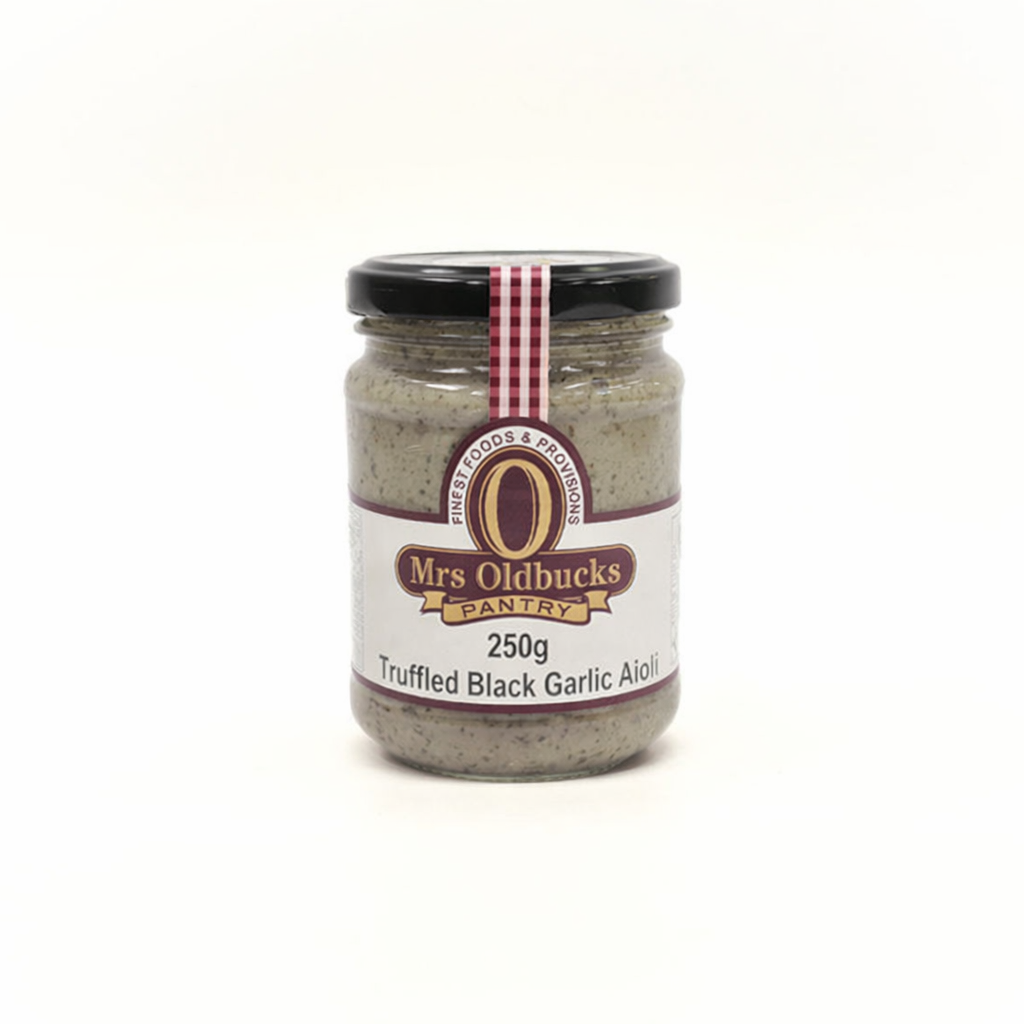 Mrs Oldbucks Pantry Truffled Black Garlic Aioli-Jar of Mrs Oldbucks Pantry Truffled Black Garlic Aioli with a creamy grey-brown texture on a soft neutral background