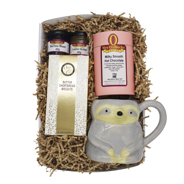Mrsoldbuckspantryslothfulsipsandtreatshamper Slothful Sips and Treats hamper featuring hot chocolate, butter shortbread biscuits, mini jam and lemon butter jars, and a grey sloth ceramic mug on a soft neutral background