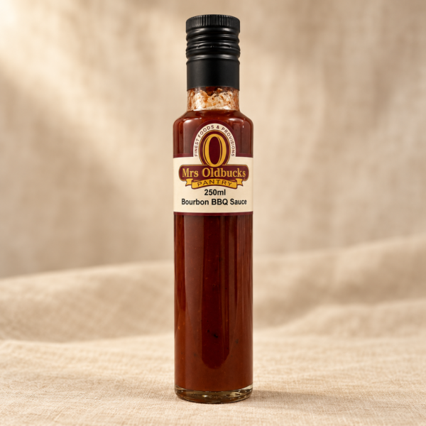 Mrs Oldbucks Pantry Bourbon BBQ Sauce 250ml bottle on a light linen background.