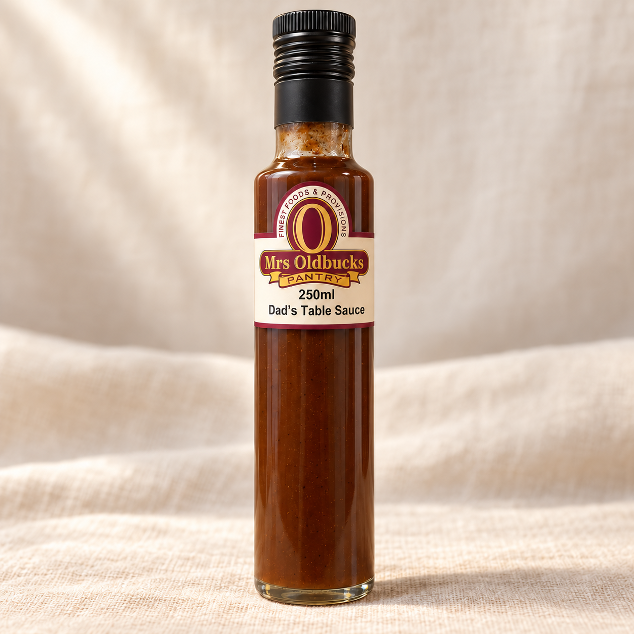 Mrs Oldbucks Pantry Dad’s Table Sauce 250ml bottle on a light linen background.